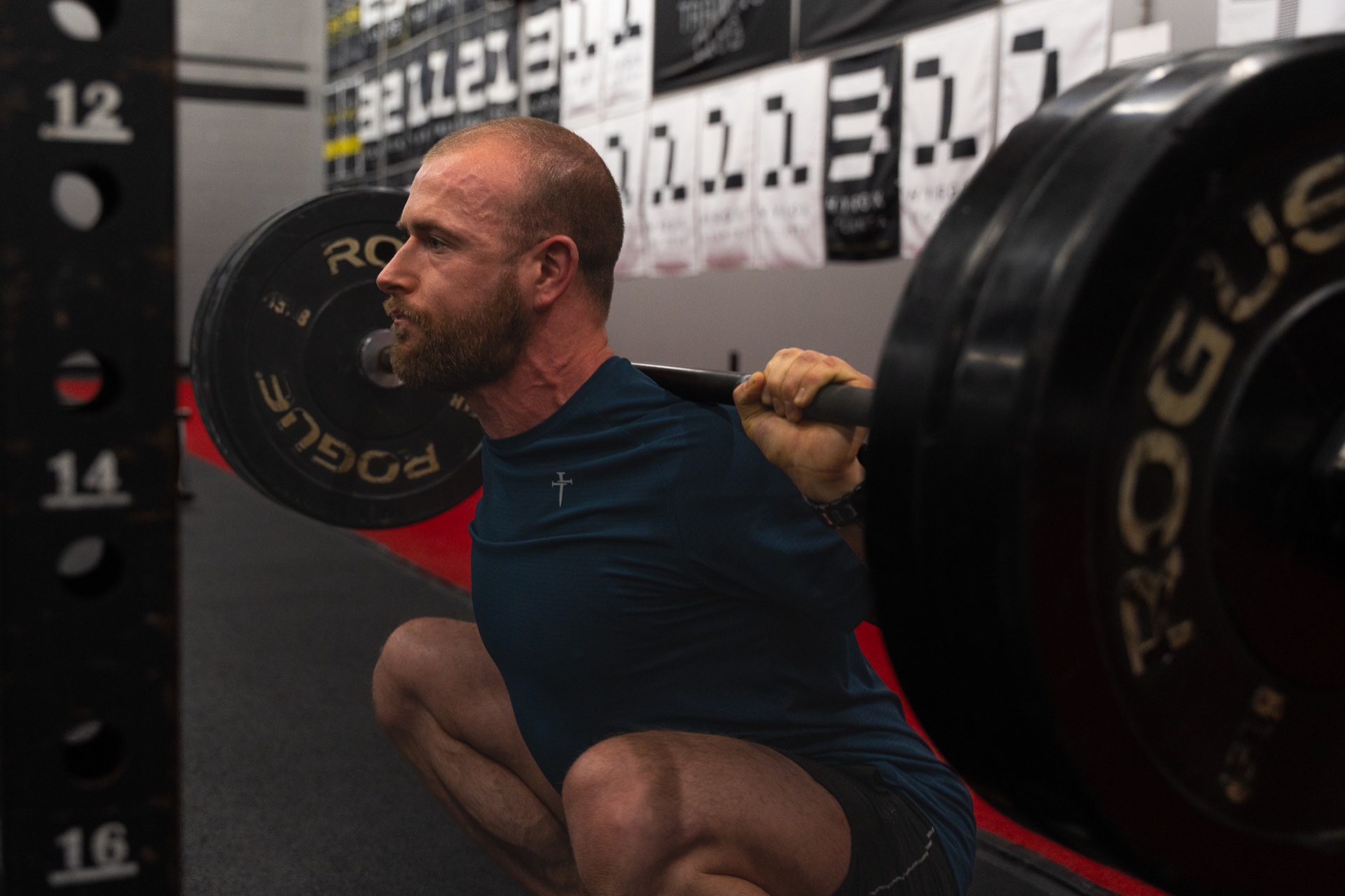 Garrett Tucker performing a barbell back squat